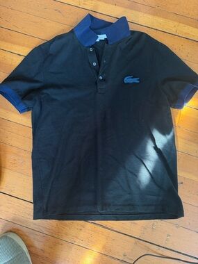 Lacoste Men’s Black Polo with Blue Collar and Trim. Gently Used